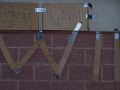 Cardboard Wii sign taped to Best Buy Wall