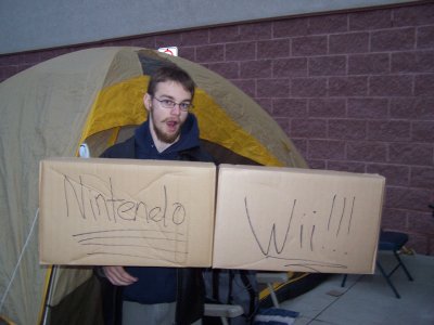 Virtuoso holding up a Nintendo Wii box sign